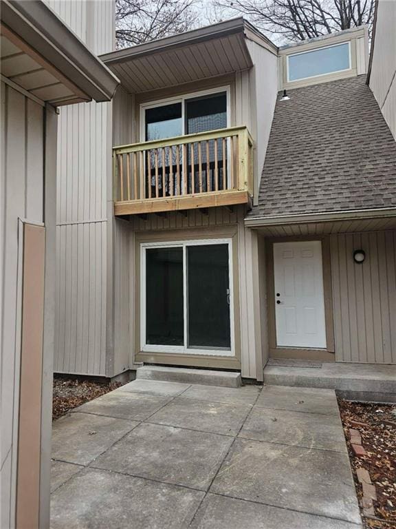 doorway to property featuring a balcony