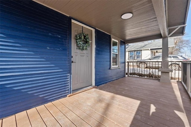 wooden deck featuring covered porch