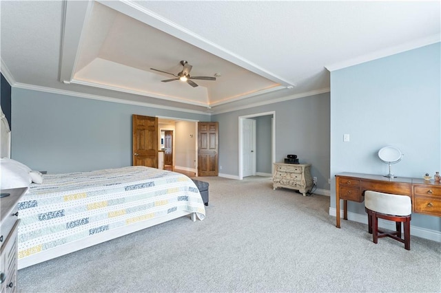 carpeted bedroom with ornamental molding, a raised ceiling, and ceiling fan