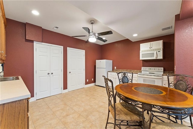 dining room with sink and ceiling fan