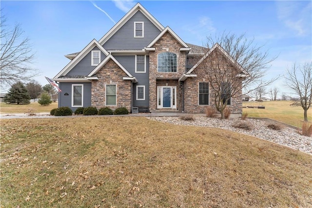 craftsman-style house with a front yard