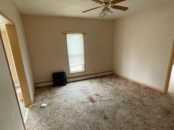 unfurnished room featuring light carpet and ceiling fan