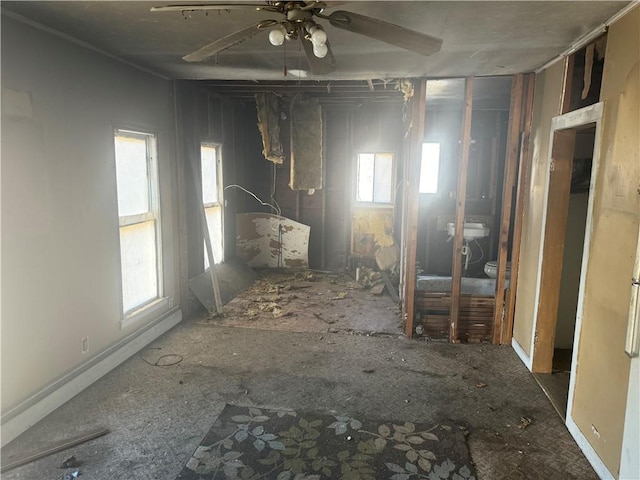 misc room featuring ceiling fan and plenty of natural light