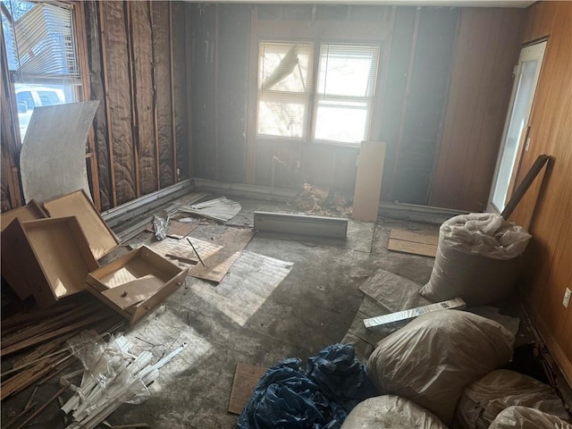 miscellaneous room featuring wood walls