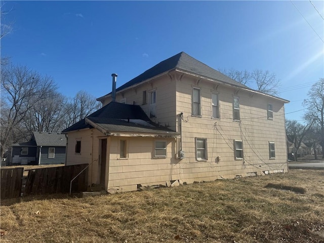 rear view of house with a yard