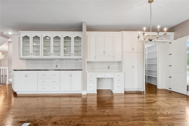 4749 SW Gull Point Dr, Lees Summit, MO 64082 - unfurnished living room featuring a chandelier and dark wood-style floors