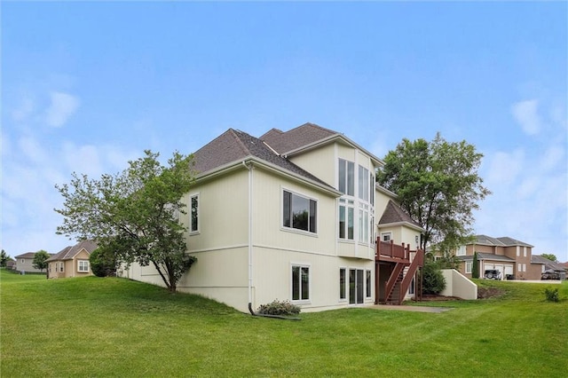 4749 SW Gull Point Dr, Lees Summit, MO 64082 - back of house with a lawn, stairs, a deck, and roof with shingles