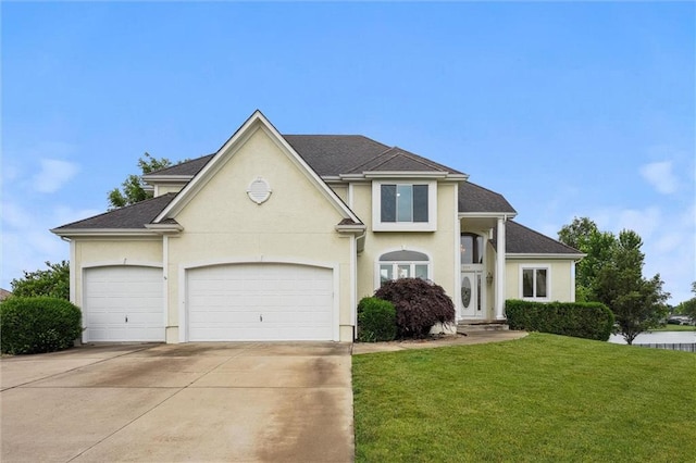4749 SW Gull Point Dr, Lees Summit, MO 64082 - view of front of home with a front lawn, driveway, a garage, and stucco siding