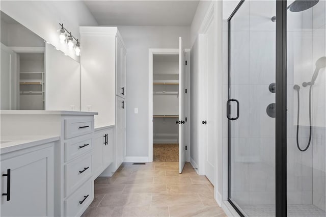 bathroom featuring an enclosed shower and vanity