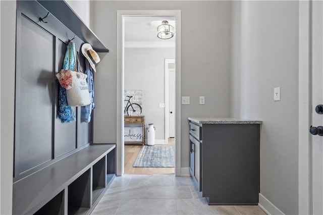 mudroom featuring crown molding