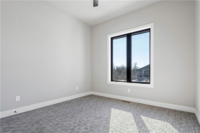 spare room with ceiling fan