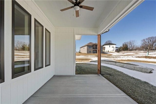 snow covered patio with ceiling fan