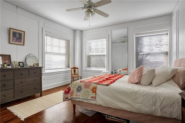 bedroom featuring dark hardwood / wood-style floors and ceiling fan