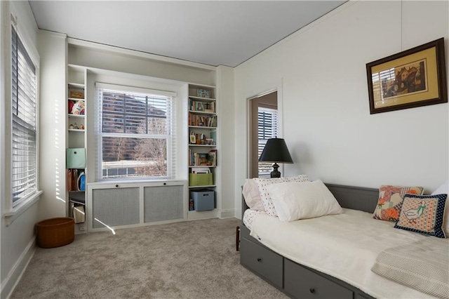 sitting room featuring light colored carpet