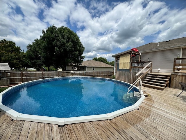 304 S Jackson St, Archie, MO 64725 - view of pool featuring a wooden deck, a fenced backyard, and stairs