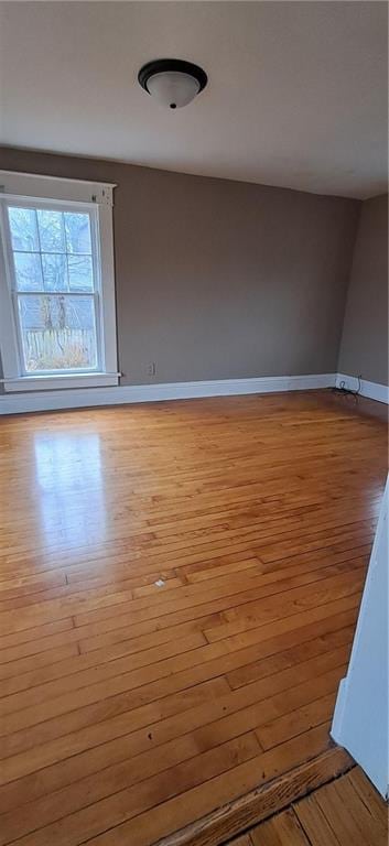 unfurnished room featuring light hardwood / wood-style flooring