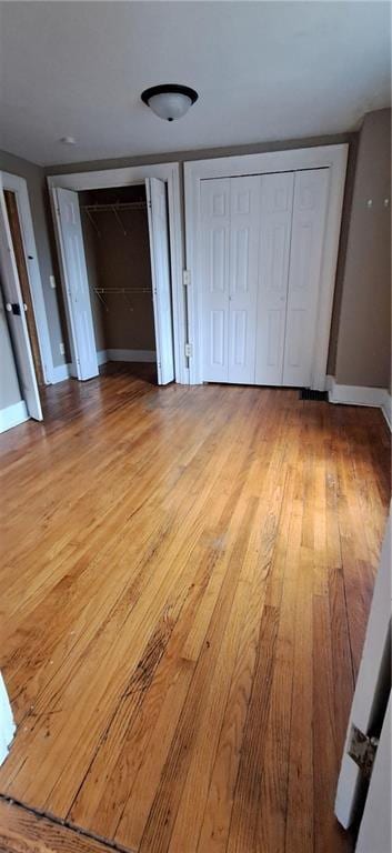 unfurnished bedroom with light hardwood / wood-style flooring