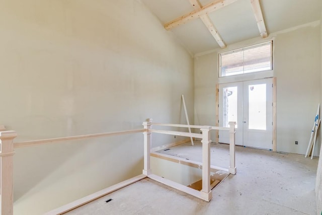 entrance foyer featuring french doors and a high ceiling