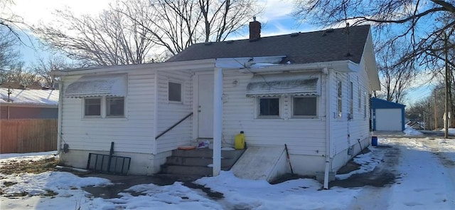 view of snow covered house