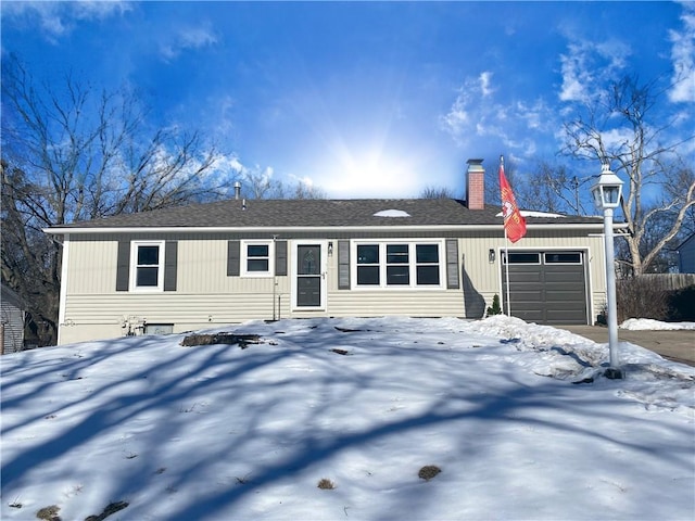 single story home featuring a garage