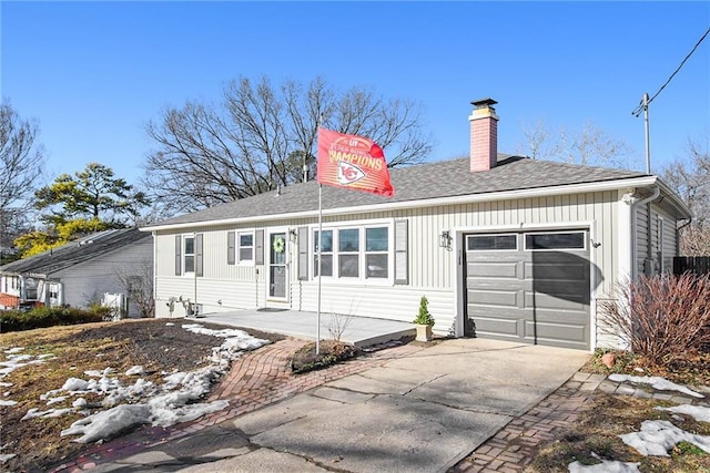 ranch-style house featuring a garage