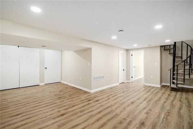 basement featuring light wood-type flooring