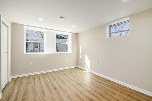 spare room featuring light hardwood / wood-style flooring