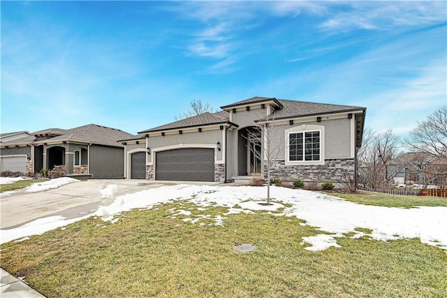 view of front of home featuring a garage and a front lawn