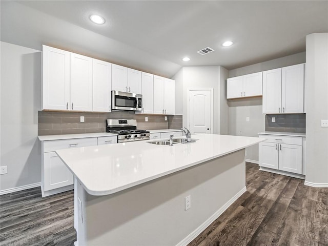 kitchen featuring sink, stainless steel appliances, and white cabinets