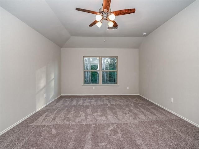 empty room with ceiling fan, carpet, and lofted ceiling