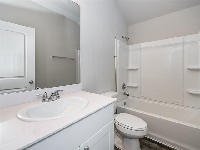 full bathroom featuring bathtub / shower combination, toilet, vanity, and hardwood / wood-style floors