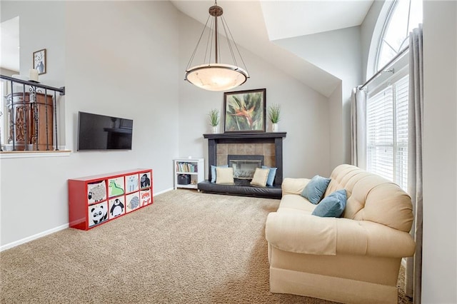 carpeted living room with lofted ceiling and a fireplace