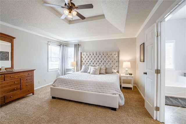 bedroom featuring ornamental molding, ceiling fan, a tray ceiling, light carpet, and a textured ceiling