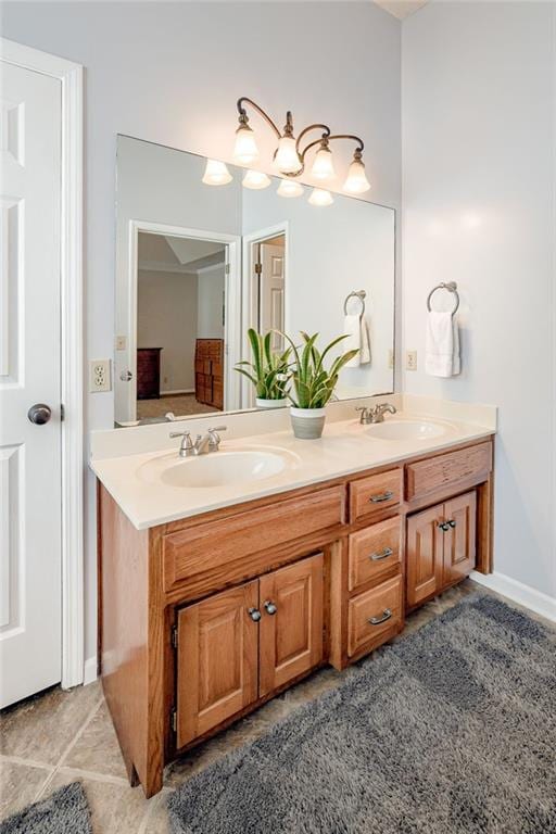 bathroom with tile patterned floors and vanity