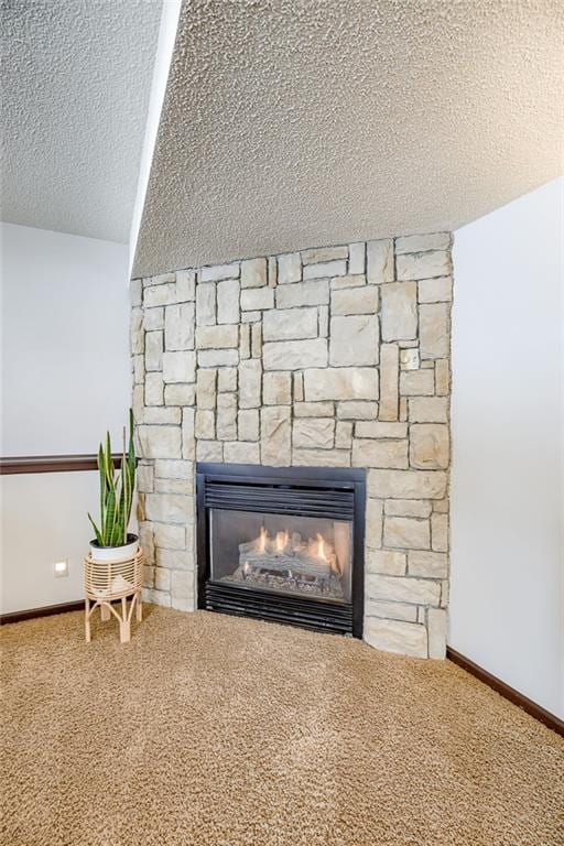 details with carpet floors, a fireplace, and a textured ceiling