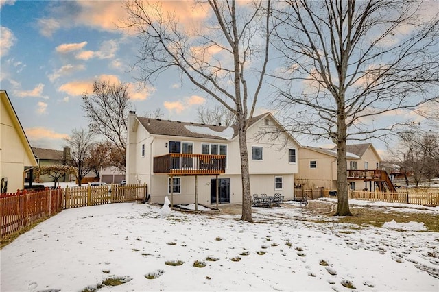 view of snow covered house