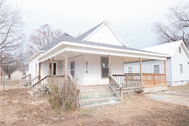 farmhouse inspired home with covered porch