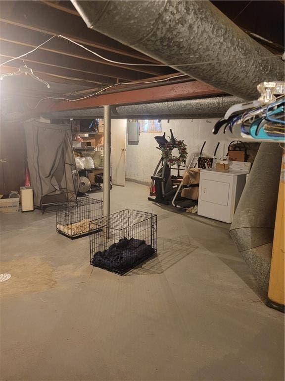 basement featuring washer / clothes dryer and electric panel