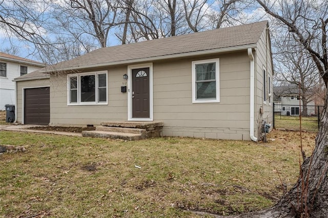 view of front facade with a garage and a front lawn