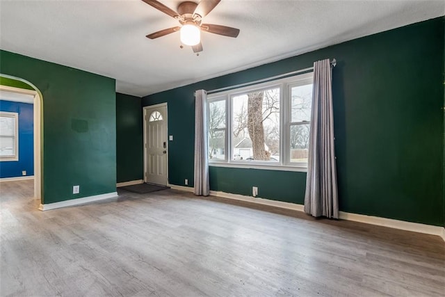 spare room with ceiling fan and light hardwood / wood-style floors