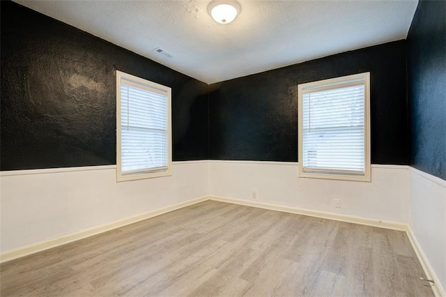 empty room with light wood-type flooring