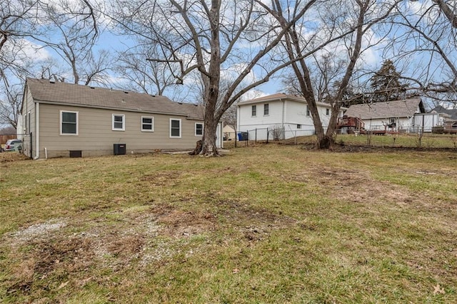 back of property featuring a lawn