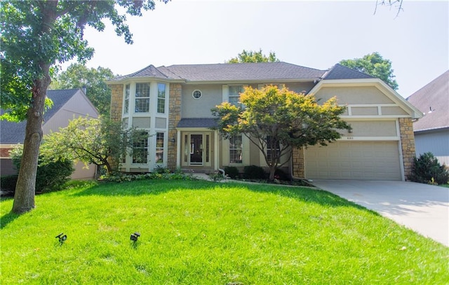 view of front of house featuring a garage and a front lawn