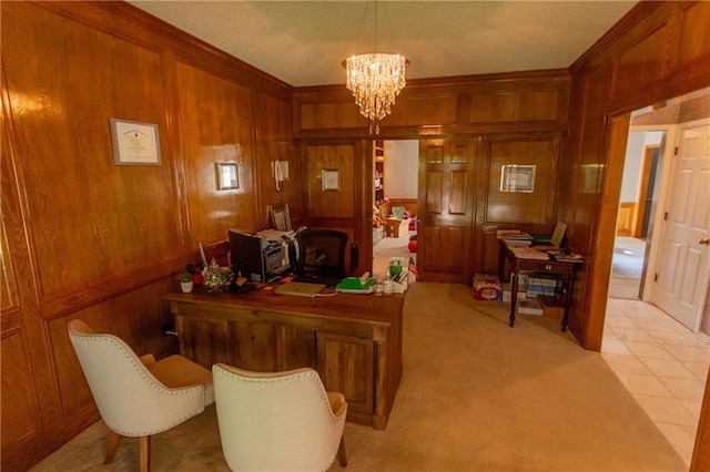 office space with wood walls, an inviting chandelier, and light tile patterned floors