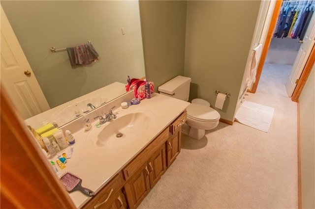 bathroom with toilet and vanity