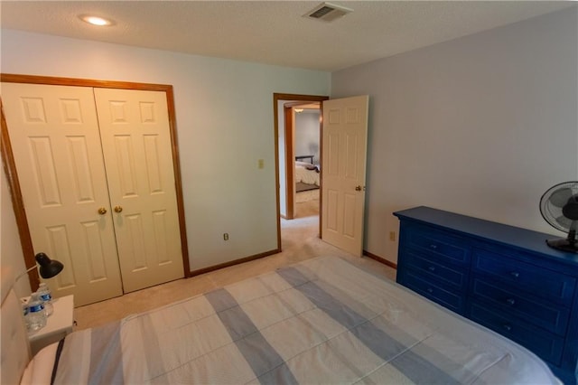 carpeted bedroom with a closet