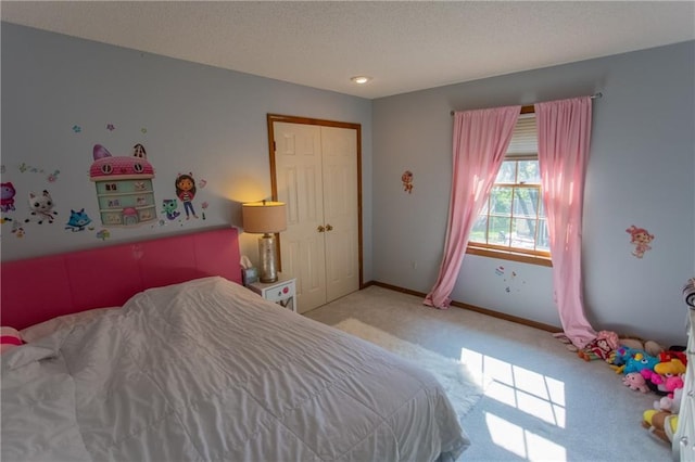 carpeted bedroom featuring a closet