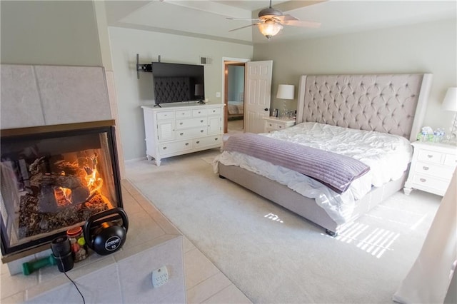 bedroom featuring ceiling fan and light carpet