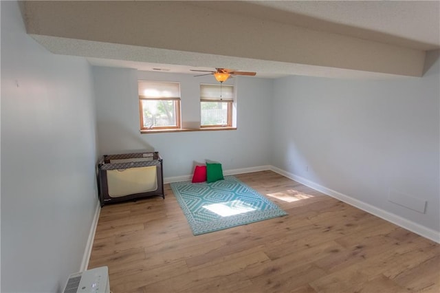 spare room featuring ceiling fan and light hardwood / wood-style flooring