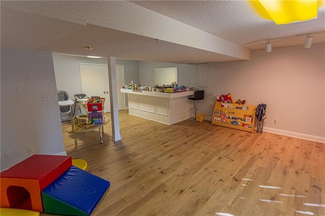 rec room featuring light hardwood / wood-style floors